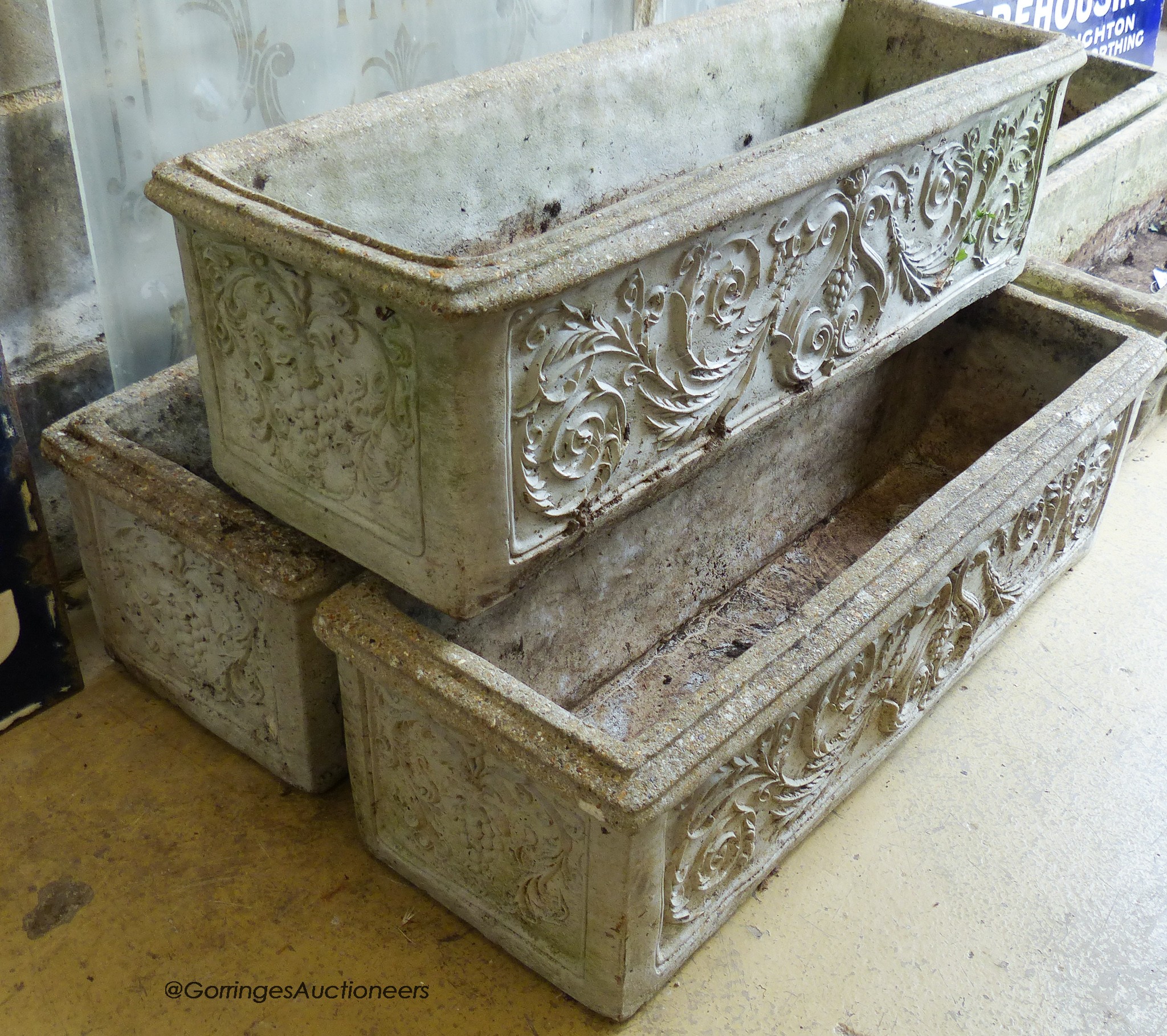 A set of three reconstituted stone rectangular garden planters. W-83, H-25cm.